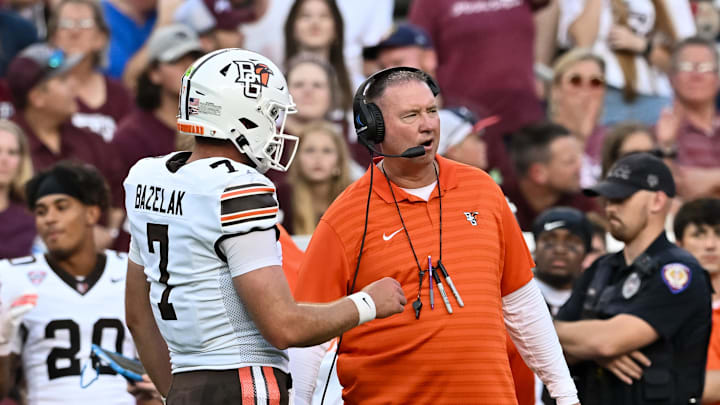 Sep 21, 2024; College Station, Texas, USA; Bowling Green Falcons head coach Scot Loeffler speaks with quarterback Connor Bazelak (7) during the first quarter against the Texas A&M Aggies at Kyle Field. Mandatory Credit: Maria Lysaker-Imagn Images. Sep 21, 2024; College Station, Texas, USA; Bowling Green Falcons head coach Scot Loeffler speaks with quarterback Connor Bazelak (7) during the first quarter against the Texas A&M Aggies at Kyle Field. Mandatory Credit: Maria Lysaker-Imagn Images.