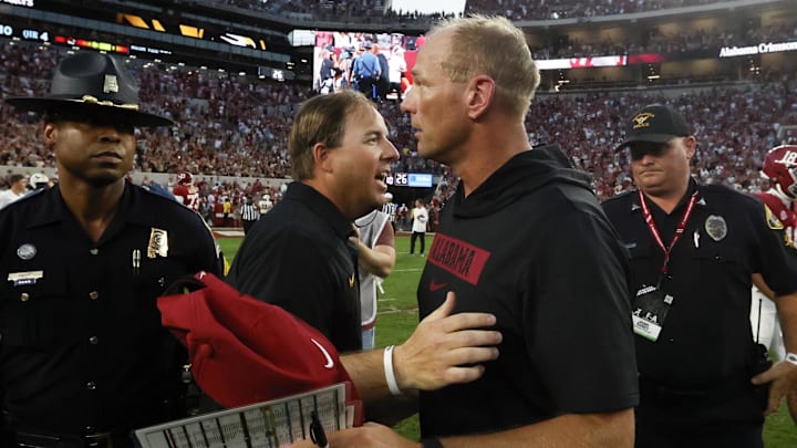 Oct 26, 2024; Tuscaloosa, Alabama, USA; Missouri Tigers head coach Eliah Drinkwitz (left) talks with Alabama Crimson Tide head coach Kalen DeBoer (right) after a game at Bryant-Denny Stadium. Mandatory Credit: Butch Dill-Imagn Images Oct 26, 2024; Tuscaloosa, Alabama, USA; Missouri Tigers head coach Eliah Drinkwitz (left) talks with Alabama Crimson Tide head coach Kalen DeBoer (right) after a game at Bryant-Denny Stadium. Mandatory Credit: Butch Dill-Imagn Images