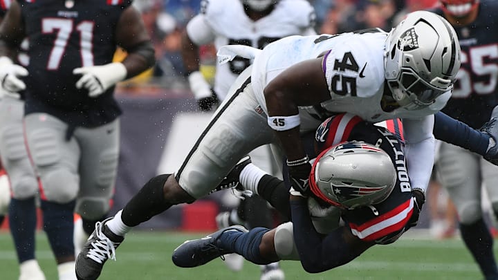 Sep 7, 2025; Foxborough, Massachusetts, USA; Las Vegas Raiders linebacker Devin White (45) tackles New England Patriots wide receiver Kayshon Boutte (9) at Gillette Stadium. Mandatory Credit: Bob DeChiara-Imagn Images