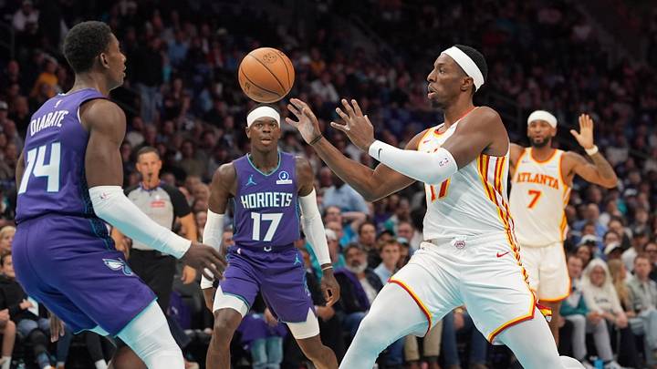 Oct 23, 2026; Charlotte, North Carolina, USA;  Atlanta Hawks forward Onyeka Okongwu (17) passes the ball defended by Charlotte Hornets forward Moussa Diabate (14) during the first half at the Spectrum Center.  Mandatory Credit: Jim Dedmon-Imagn Images