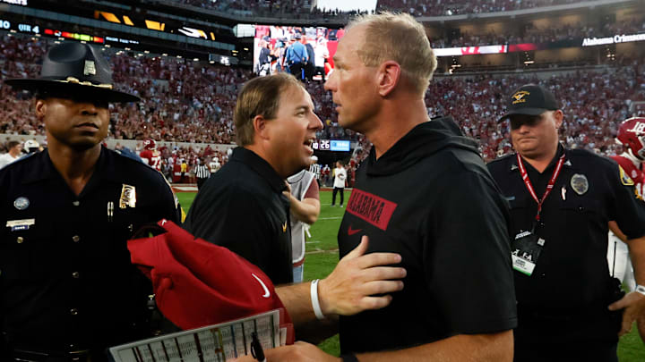 Missouri Tigers head coach Eliah Drinkwitz (left) talks with Alabama Crimson Tide head coach Kalen DeBoer (right) after a game at Bryant-Denny Stadium. 