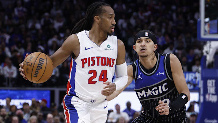 Apr 29, 2026; Detroit, Michigan, USA; Detroit Pistons guard Daniss Jenkins (24) dribbles defended by Orlando Magic guard Anthony Black (0) in the second half during game five of the first round of the 2026 NBA Playoffs at Little Caesars Arena. Mandatory Credit: Rick Osentoski-Imagn Images