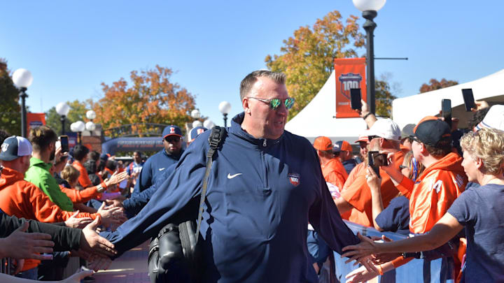Oct 19, 2024; Champaign, Illinois, USA; Illinois Fighting Illini head coach Bret Bielema leads his team into the stadium before kickoff against the Michigan Wolverines game at Memorial Stadium. Mandatory Credit: Ron Johnson-Imagn Images