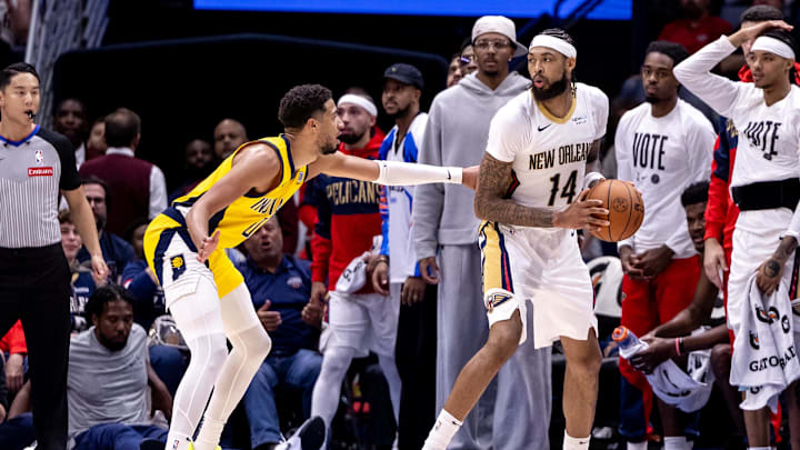 Nov 1, 2024; New Orleans, Louisiana, USA;  New Orleans Pelicans forward Brandon Ingram (14) looks to pass the ball against Indiana Pacers guard Tyrese Haliburton (0) during the second half at Smoothie King Center. Mandatory Credit: Stephen Lew-Imagn Images