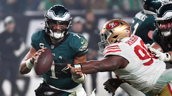 Dec 3, 2023; Philadelphia, Pennsylvania, USA; Philadelphia Eagles quarterback Jalen Hurts (1) is tackled by San Francisco 49ers defensive tackle Javon Hargrave (98) during the fourth quarter at Lincoln Financial Field. Mandatory Credit: Eric Hartline-Imagn Images