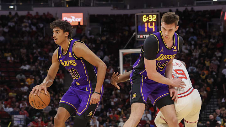 Nov 8, 2023; Houston, Texas, USA; Los Angeles Lakers guard Max Christie (10) dribbles as center Colin Castleton (14) sets up a pick against Houston Rockets guard Nate Williams (19) in the second half at Toyota Center. Mandatory Credit: Thomas Shea-USA TODAY Sports Nov 8, 2023; Houston, Texas, USA; Los Angeles Lakers guard Max Christie (10) dribbles as center Colin Castleton (14) sets up a pick against Houston Rockets guard Nate Williams (19) in the second half at Toyota Center. Mandatory Credit: Thomas Shea-USA TODAY Sports