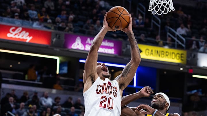 Dec 1, 2025; Indianapolis, Indiana, USA;  Cleveland Cavaliers guard Jaylon Tyson (20) shoots the ball while  Indiana Pacers forward Jarace Walker (5) defends in the first half at Gainbridge Fieldhouse. Mandatory Credit: Trevor Ruszkowski-Imagn Images