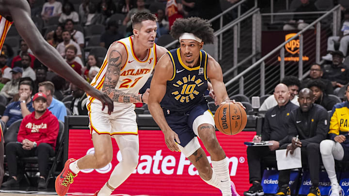 Oct 8, 2024; Atlanta, Georgia, USA; Indiana Pacers guard Kendall Brown (10) dribbles past Atlanta Hawks guard Vit Krejci (27) during the second half at State Farm Arena. Mandatory Credit: Dale Zanine-Imagn Images