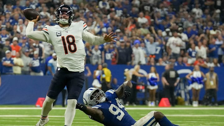 Indianapolis Colts defensive end Tyquan Lewis (94) tries to tackle Chicago Bears quarterback Caleb Williams (18) on Sunday, Sept. 22, 2024, during a game against the Chicago Bears at Lucas Oil Stadium in Indianapolis.