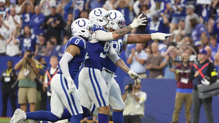 Oct 5, 2025; Indianapolis, Indiana, USA; Indianapolis Colts defensive end Laiatu Latu (97) celebrates with teammates after making an interception against the Las Vegas Raiders during the second quarter at Lucas Oil Stadium. 