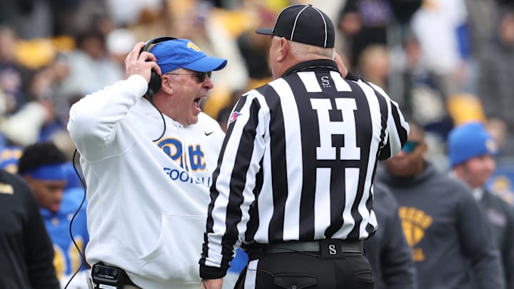 Nov 29, 2025; Pittsburgh, Pennsylvania, USA; Pittsburgh Panthers head coach Pat Narduzzi reacts to head linesman Kirk Lewis (right) during the first quarter against the Miami Hurricanes at Acrisure Stadium. Mandatory Credit: Charles LeClaire-Imagn Images Nov 29, 2025; Pittsburgh, Pennsylvania, USA; Pittsburgh Panthers head coach Pat Narduzzi reacts to head linesman Kirk Lewis (right) during the first quarter against the Miami Hurricanes at Acrisure Stadium. Mandatory Credit: Charles LeClaire-Imagn Images