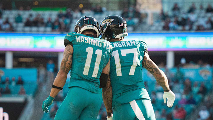 Dec 1, 2024; Jacksonville, Florida, USA; Jacksonville Jaguars wide receiver Parker Washington (11) and tight end Evan Engram (17) celebrate a touchdown against the Houston Texans in the fourth quarter at EverBank Stadium. Mandatory Credit: Jeremy Reper-Imagn Images Dec 1, 2024; Jacksonville, Florida, USA; Jacksonville Jaguars wide receiver Parker Washington (11) and tight end Evan Engram (17) celebrate a touchdown against the Houston Texans in the fourth quarter at EverBank Stadium. Mandatory Credit: Jeremy Reper-Imagn Images