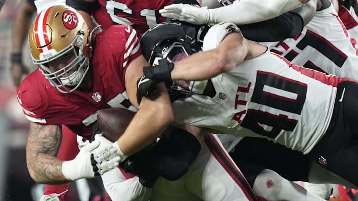 Oct 19, 2025; Santa Clara, California, USA; San Francisco 49ers guard Connor Colby (75) recovers a fumble in front of Atlanta Falcons linebacker JD Bertrand (40) during the second quarter at Levi's Stadium. Mandatory Credit: Kyle Terada-Imagn Images