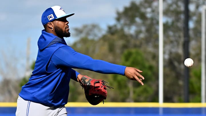 Feb 17, 2025; Dunedin, FL, USA; Toronto Blue Jays infielder Vladimir Guerrero Jr. (27) flips the ball towards first base during spring training at Cecil B. Englebert Complex. Mandatory Credit: Jonathan Dyer-Imagn Images