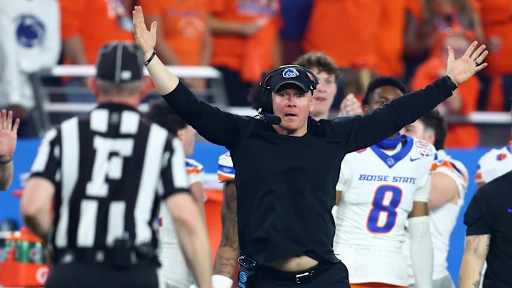 Dec 31, 2024; Glendale, AZ, USA; Boise State Broncos head coach Spencer Danielson reacts toward the referee against the Penn State Nittany Lions during the first half in the Fiesta Bowl at State Farm Stadium. Mandatory Credit: Mark J. Rebilas-Imagn Images