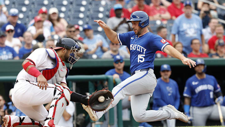 Sep 26, 2024; Washington, District of Columbia, USA; Kansas City Royals shortstop Paul DeJong (15) scores a run ahead of a tag by Washington Nationals catcher Keibert Ruiz (20) during the fourth inning at Nationals Park. Mandatory Credit: Geoff Burke-Imagn Images