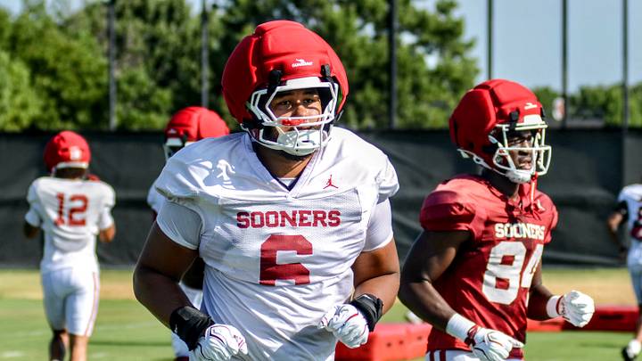 Oklahoma defensive lineman Nigel Smith II jogs between drills at practice. Oklahoma defensive lineman Nigel Smith II jogs between drills at practice.