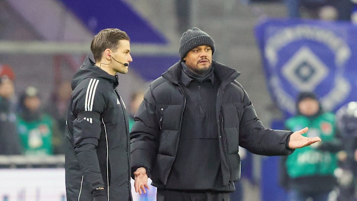 Disappointed Vincent Kompany on the sidelines during Bayern Munich's 2-2 draw against Hamburg.