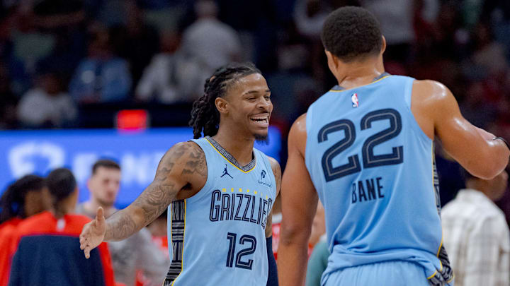 Dec 27, 2024; New Orleans, Louisiana, USA;  Memphis Grizzlies guard Ja Morant (12) reacts with Memphis Grizzlies guard Desmond Bane (22) at halftime against the Memphis Grizzlies at Smoothie King Center. Mandatory Credit: Matthew Hinton-Imagn Images