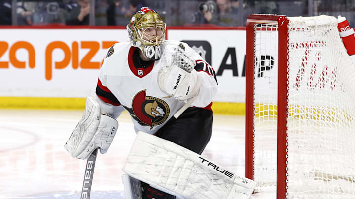 Mar 30, 2024; Winnipeg, Manitoba, CAN; Ottawa Senators goaltender Joonas Korpisalo (70) warms up before the start of the second period against the Winnipeg Jets at Canada Life Centre. Mandatory Credit: James Carey Lauder-Imagn Images