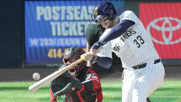 Milwaukee Brewers catcher Danny Jansen (33) hits a two-run home run during the fourth inning of their game against the Cincinnati Reds Sunday, September 28, 2025 at American Family Field in Milwaukee, Wisconsin.