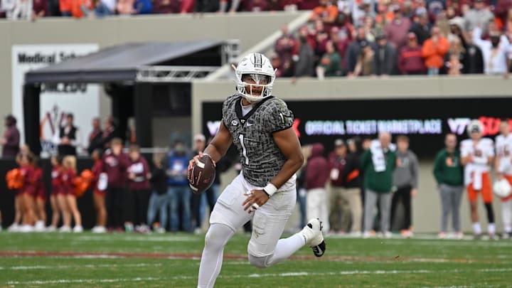 Nov 22, 2025; Blacksburg, Virginia, USA; Virginia Tech Hokies quarterback Kyron Drones (1) looks to pass against the Miami (FL) Hurricanes during the first quarter at Lane Stadium. Mandatory Credit: Brian Bishop-Imagn Images Nov 22, 2025; Blacksburg, Virginia, USA; Virginia Tech Hokies quarterback Kyron Drones (1) looks to pass against the Miami (FL) Hurricanes during the first quarter at Lane Stadium. Mandatory Credit: Brian Bishop-Imagn Images
