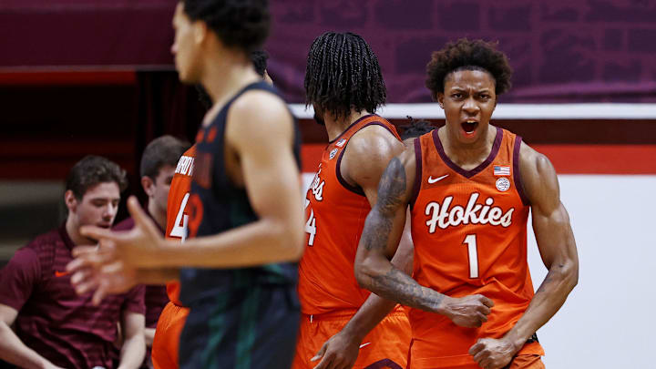 Jan 4, 2025; Blacksburg, Virginia, USA; Virginia Tech Hokies forward Tobi Lawal (1) celebrates after a play during the second half against the Miami Hurricanes at Cassell Coliseum. Mandatory Credit: Peter Casey-Imagn Images