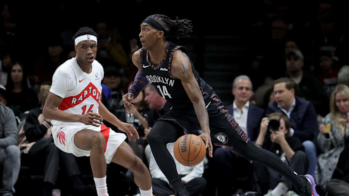 Nov 11, 2025; Brooklyn, New York, USA; Brooklyn Nets guard Terance Mann (14) controls the ball against Toronto Raptors guard Ja'Kobe Walter (14) during the second quarter at Barclays Center. Mandatory Credit: Brad Penner-Imagn Images