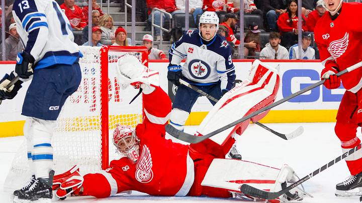 Oct 4, 2026; Detroit, Michigan, USA;  Detroit Red Wings goaltender John Gibson (36) attempts to make a save during the first period against the Winnipeg Jets at Little Caesars Arena.  Mandatory Credit: Brian Bradshaw Sevald-Imagn Images