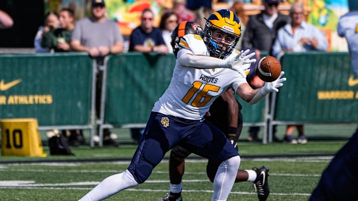 Clarkston wide receiver Mick Mahaffy (16) make a catch against Belleville during the first half of Prep Kickoff Classic at Wayne State University' Adams Field in Detroit on Thursday, August 28, 2025. Clarkston wide receiver Mick Mahaffy (16) make a catch against Belleville during the first half of Prep Kickoff Classic at Wayne State University' Adams Field in Detroit on Thursday, August 28, 2025.