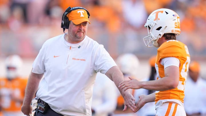 Tennessee coach Josh Heupel high-fives Tennessee place kicker Max Gilbert (90) during a college football game between Tennessee and Arkansas at Neyland Stadium in Knoxville, Tenn., on Oct. 11, 2025. Tennessee coach Josh Heupel high-fives Tennessee place kicker Max Gilbert (90) during a college football game between Tennessee and Arkansas at Neyland Stadium in Knoxville, Tenn., on Oct. 11, 2025.