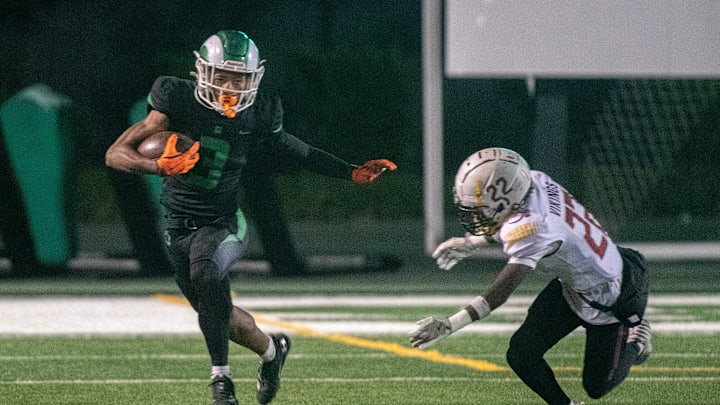 St. Mary’s Kenneth Moore III, left, evades Edison’s Elijah Wilkerson during a varsity football game at St. Mary’s Sangunetti Field in Stockton on Oct. 18, 2024. St. Mary’s won 35-23.