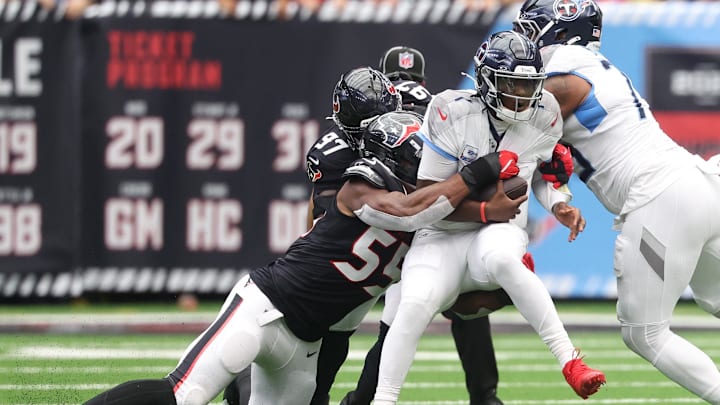 Sep 28, 2025; Houston, Texas, USA; Houston Texans defensive end Danielle Hunter (55) sacks Tennessee Titans quarterback Cam Ward (1) during the first half at NRG Stadium. Mandatory Credit: Troy Taormina-Imagn Images