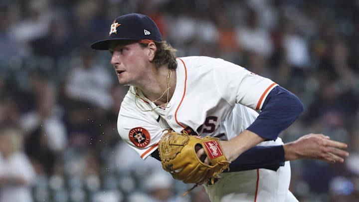 Forrest Whitley (55) delivers a pitch 