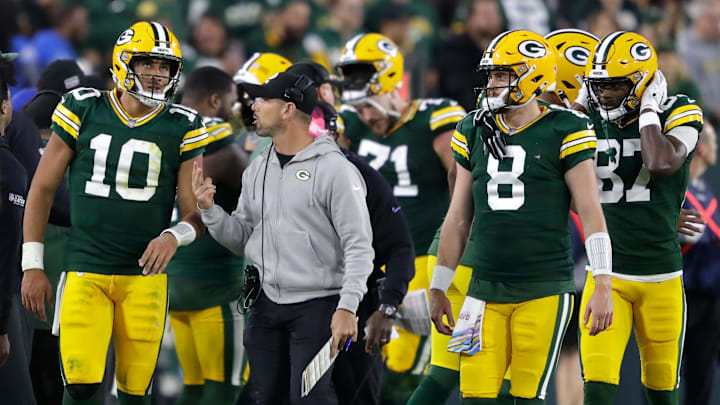 Green Bay Packers head coach Matt LaFleur talks with quarterback Jordan Love (10) after a failed two