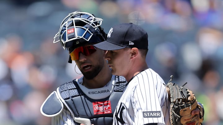 May 7, 2026; Bronx, New York, USA; New York Yankees catcher J.C. Escarra (25) hugs relief pitcher Brendan Beck (89) after the top of the second inning at Yankee Stadium. Beck is making his major league debut. Mandatory Credit: Brad Penner-Imagn Images