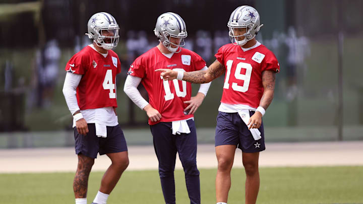 Jun 4, 2024; Frisco, TX, USA;  Dallas Cowboys quarterback Dak Prescott (4) and quarterback Cooper Rush (10) and quarterback Trey Lance (19) talk during practice at the Ford Center at the Star Training Facility in Frisco, Texas. Mandatory Credit: Tim Heitman-Imagn Images