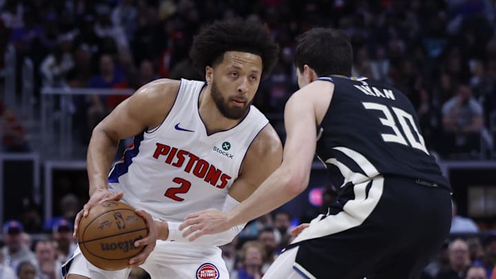 Apr 08, 2026; Detroit, MI, USA; Detroit Pistons guard Cade Cunningham (2) handles the ball against Milwaukee Bucks guard Cormac Ryan (30) in the second half at Little Caesars Arena. Mandatory Credit: Rick Osentoski-Imagn Images