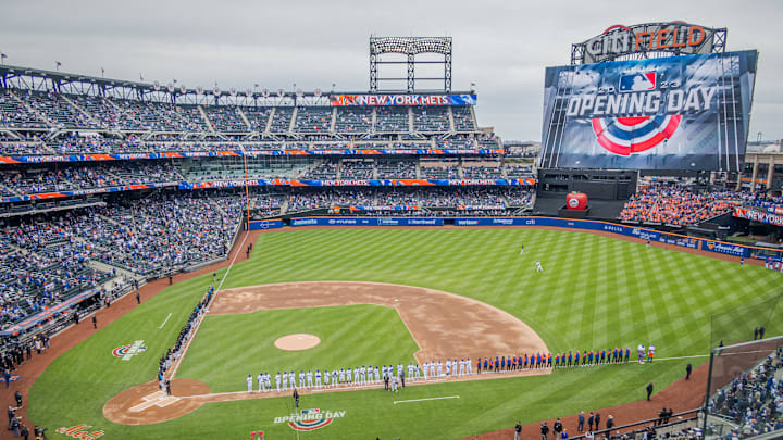 The scene at the Mets opening day. Mets fans and climate...
