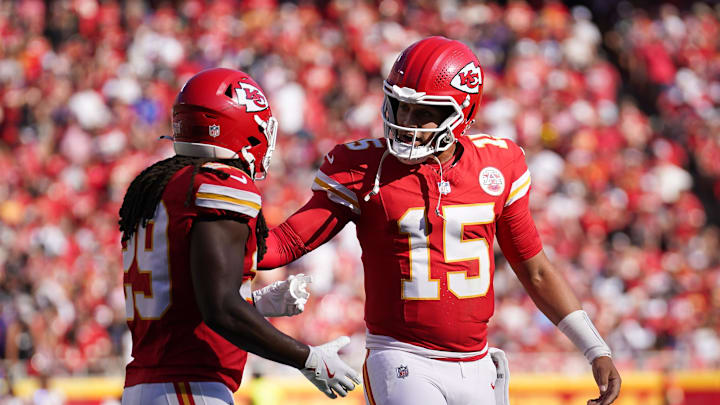 Sep 28, 2025; Kansas City, Missouri, USA;  Kansas City Chiefs quarterback Patrick Mahomes (15) speaks with Kansas City Chiefs running back Kareem Hunt (29) during the second quarter against the Baltimore Ravens at GEHA Field at Arrowhead Stadium. Mandatory Credit: Denny Medley-Imagn Images