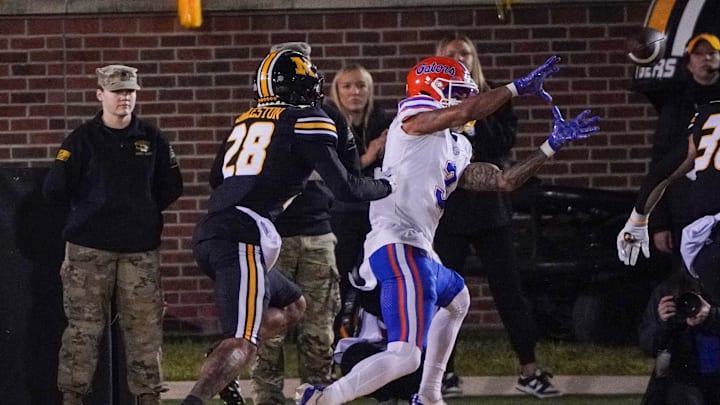 Nov 18, 2023; Columbia, Missouri, USA; Florida Gators wide receiver Eugene Wilson III (3) catches a pass for a touchdown as Missouri Tigers defensive back Joseph Charleston (28) chases during the first half at Faurot Field at Memorial Stadium. Mandatory Credit: Denny Medley-Imagn Images