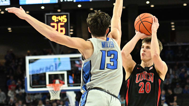 UNLV Rebels guard Julian Rishwain (20) attempt a shot against Creighton Bluejays forward Mason Miller (13) in the first half at CHI Health Center Omaha. 