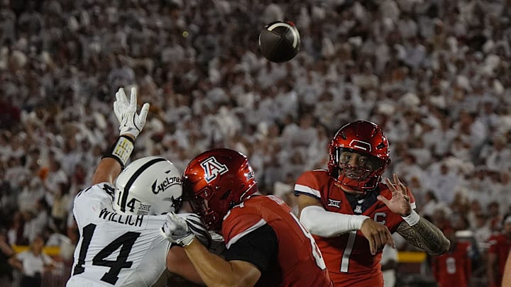Arizona Wildcats quarterback Noah Fifita (1) passes the ball over Iowa State Cyclones' linebacker Carson Willich (14) during the third quarter in the Big-12 conference showdown on Sept. 27, 2025, at Jack Trice Stadium in Ames, Iowa.