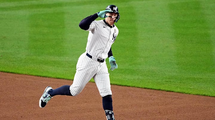 Oct 30, 2024; New York, New York, USA; New York Yankees outfielder Aaron Judge (99) celebrates after hitting a two run home run during the first inning against the Los Angeles Dodgers in game four of the 2024 MLB World Series at Yankee Stadium. Mandatory Credit: Robert Deutsch-Imagn Images