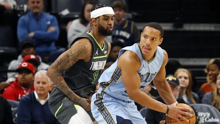 Memphis Grizzlies guard Desmond Bane looks to pass the ball as Minnesota Timberwolves guard Nickeil Alexander-Walker. Memphis Grizzlies guard Desmond Bane looks to pass the ball as Minnesota Timberwolves guard Nickeil Alexander-Walker.