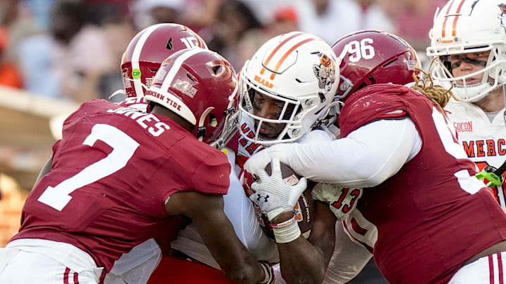 Nov 16, 2024; Tuscaloosa, AL, USA; Mercer Bears wide receiver Kelin Parsons (13) is tackled by Alabama Crimson Tide defensive back DaShawn Jones (7) and defensive lineman Tim Keenan III (96) at Bryant-Denny Stadium. Nov 16, 2024; Tuscaloosa, AL, USA; Mercer Bears wide receiver Kelin Parsons (13) is tackled by Alabama Crimson Tide defensive back DaShawn Jones (7) and defensive lineman Tim Keenan III (96) at Bryant-Denny Stadium.