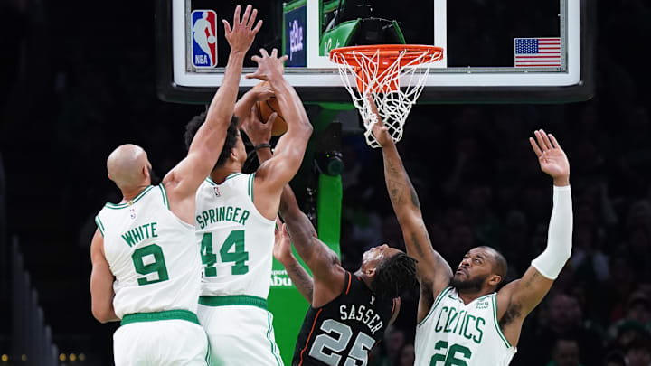 Mar 18, 2024; Boston, Massachusetts, USA; Boston Celtics guard Jaden Springer (44), guard Derrick White (9) and forward Xavier Tillman (26) defend against Detroit Pistons guard Marcus Sasser (25) in the second quarter at TD Garden. Mandatory Credit: David Butler II-Imagn Images