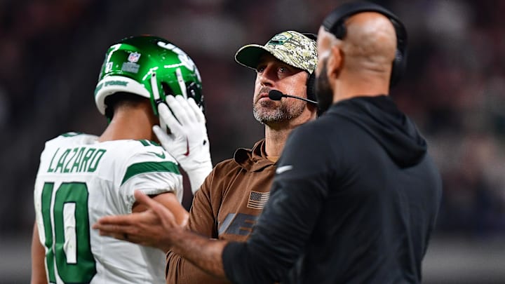 Nov 12, 2023; Paradise, Nevada, USA; New York Jets quarterback Aaron Rodgers watches game action against the Las Vegas Raiders during the first half at Allegiant Stadium. Mandatory Credit: Gary A. Vasquez-Imagn Images