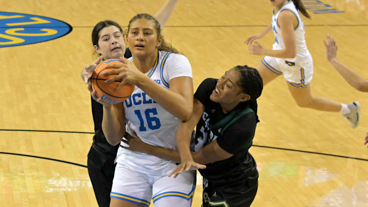 Dec 16, 2025; Los Angeles, California, USA;  UCLA Bruins forward Sienna Betts (16) battles Cal Poly Mustangs guard Katie Peiffer (8) and forward Charish Thompson (32) for a rebound during the first half at Pauley Pavilion presented by Wescom Financial. Mandatory Credit: Jayne Kamin-Oncea-Imagn Images