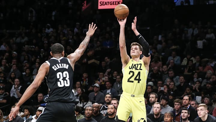 Apr 2, 2023; Brooklyn, New York, USA;  Utah Jazz center Walker Kessler (24) shoots over Brooklyn Nets center Nic Claxton (33) in the third quarter at Barclays Center. Mandatory Credit: Wendell Cruz-Imagn Images
